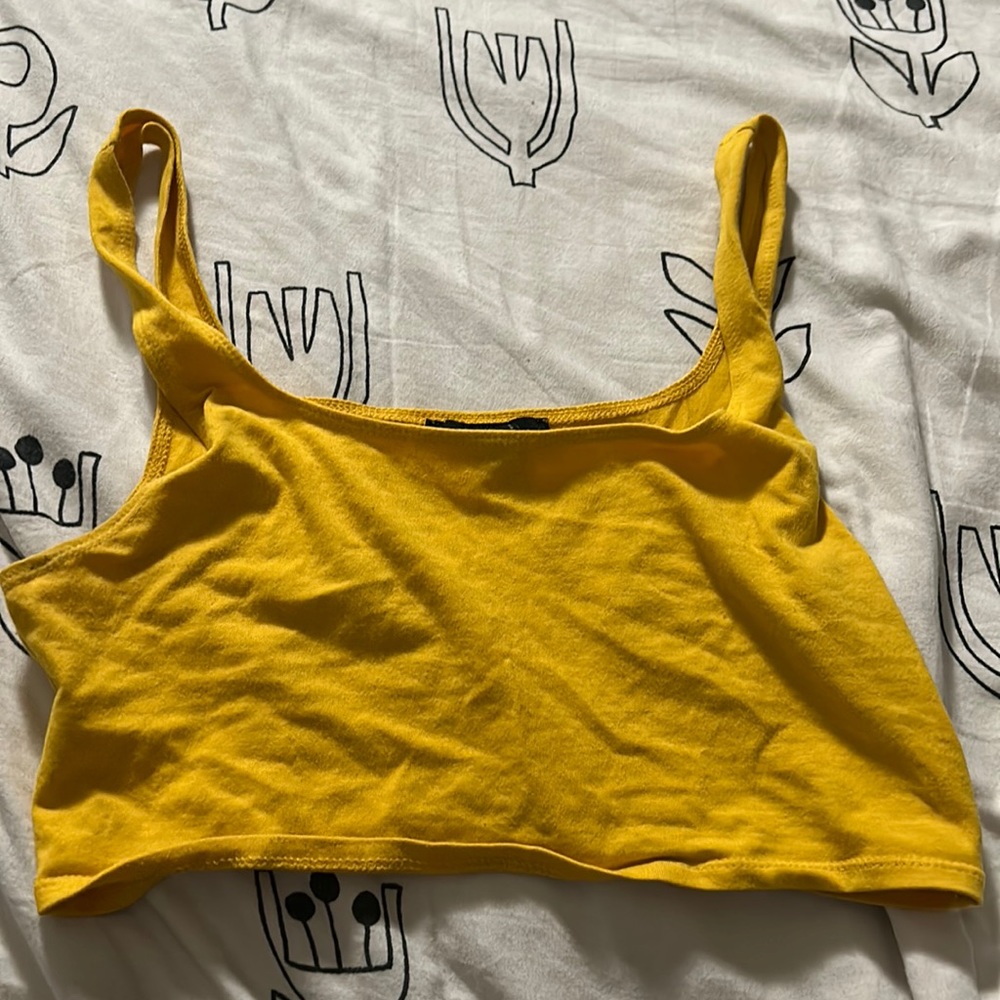 A woman crop top. Mustard color from forever 21